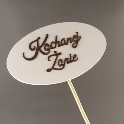 Tabliczka na piku z napisem: Kochanej Żonie